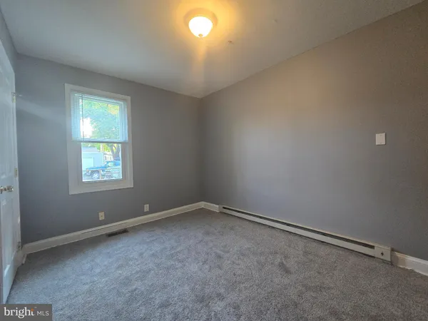 a kitchen with stainless steel appliances granite countertop a refrigerator and a stove