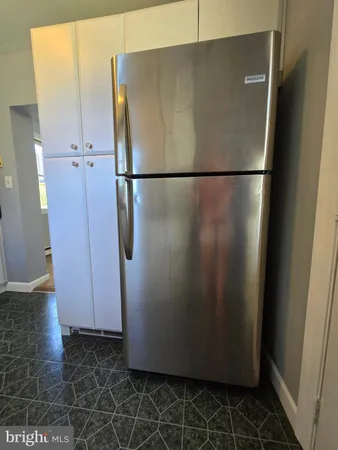 an aerial view of a house with a garden and lake view