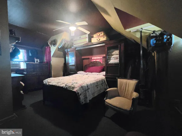 a view of a livingroom with wooden floor and a window