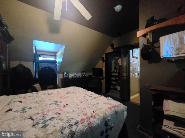 a view of a big room with wooden floor and windows