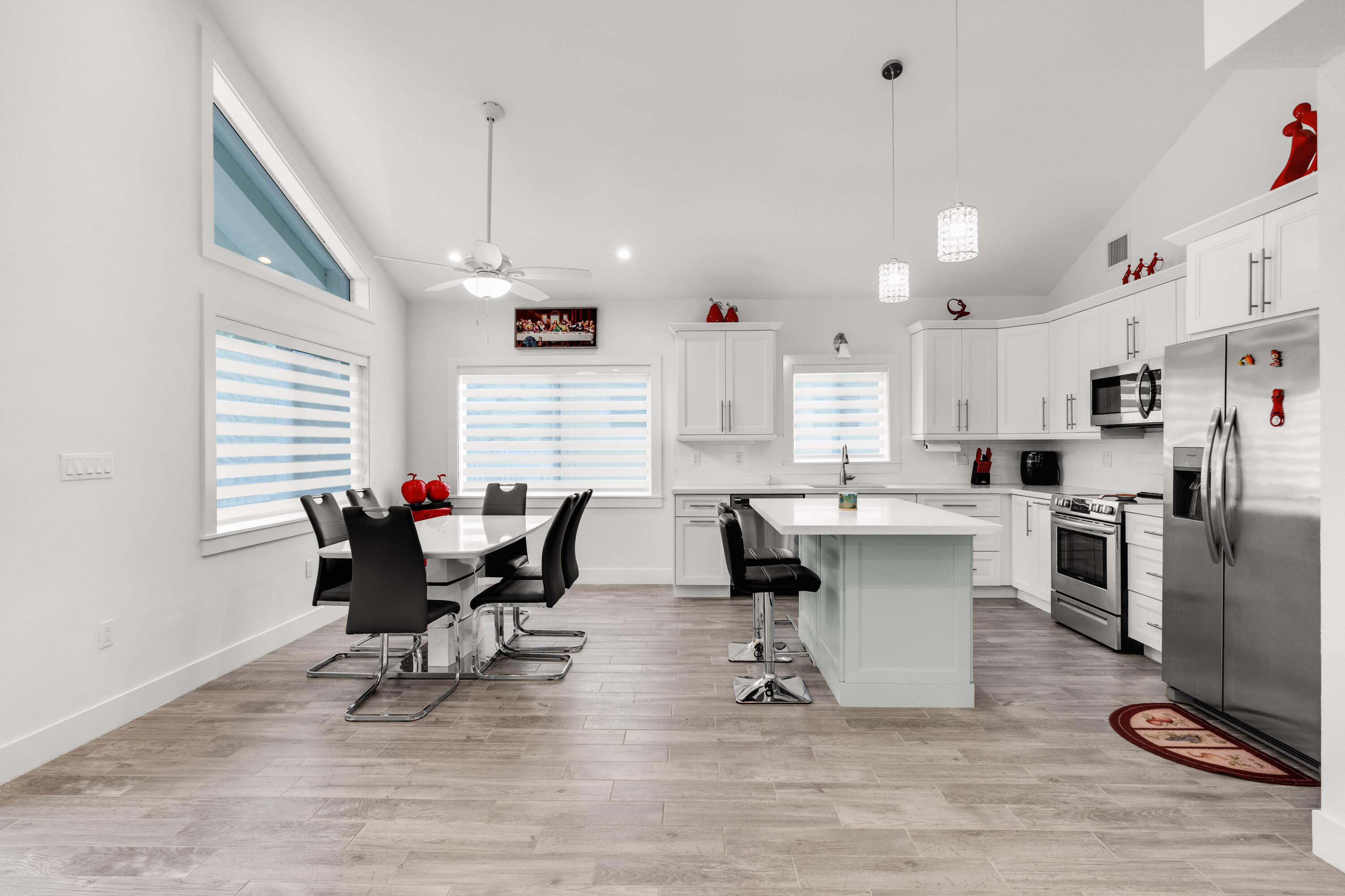 1023 Valencia Road Key Largo, FL 33037 - Photo 15 of 32 a outdoor kitchen with white cabinets and stainless steel appliances
