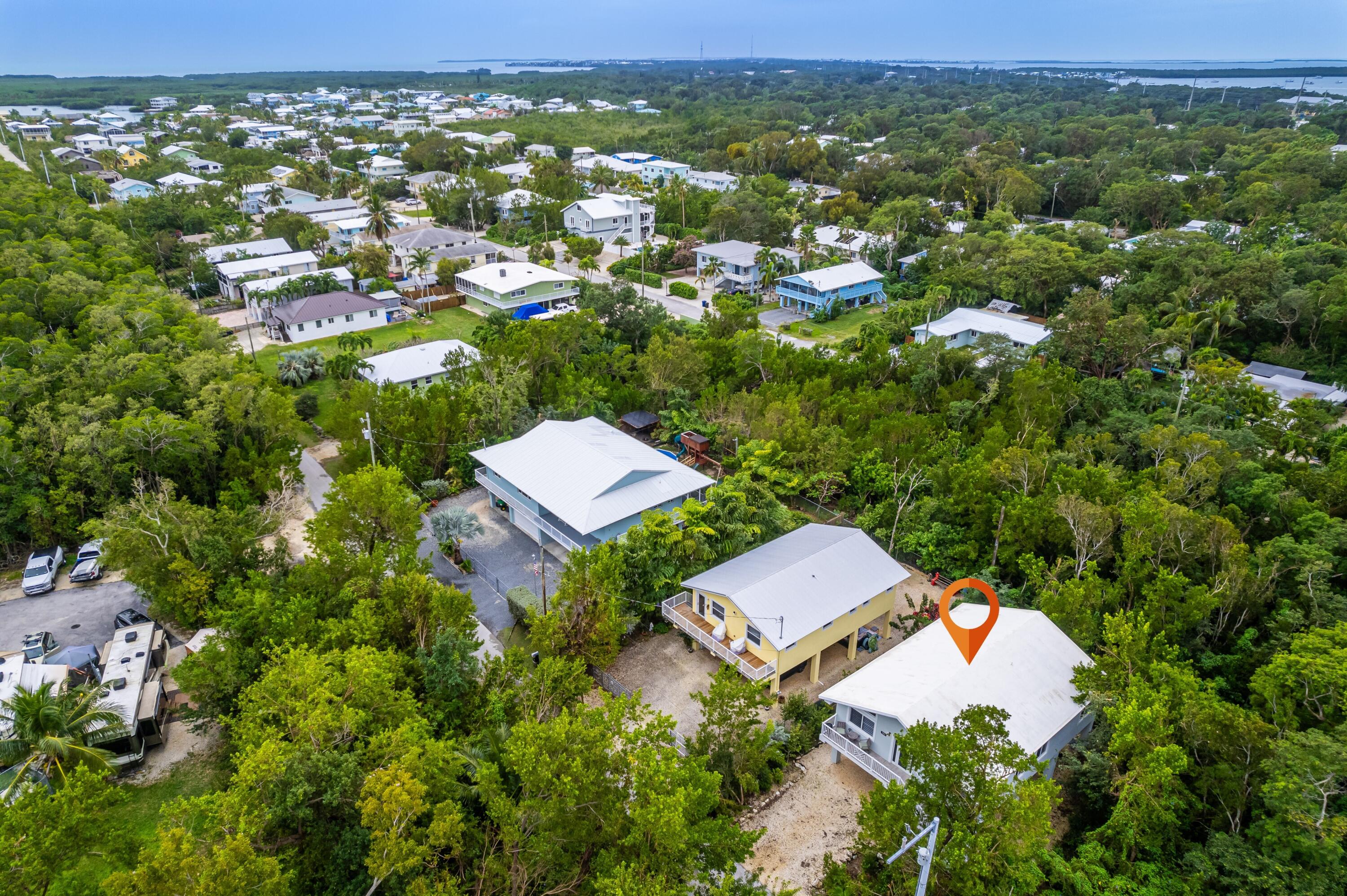 1023 Valencia Road Key Largo, FL 33037 - Photo 3 of 32 an aerial view of a house with a yard