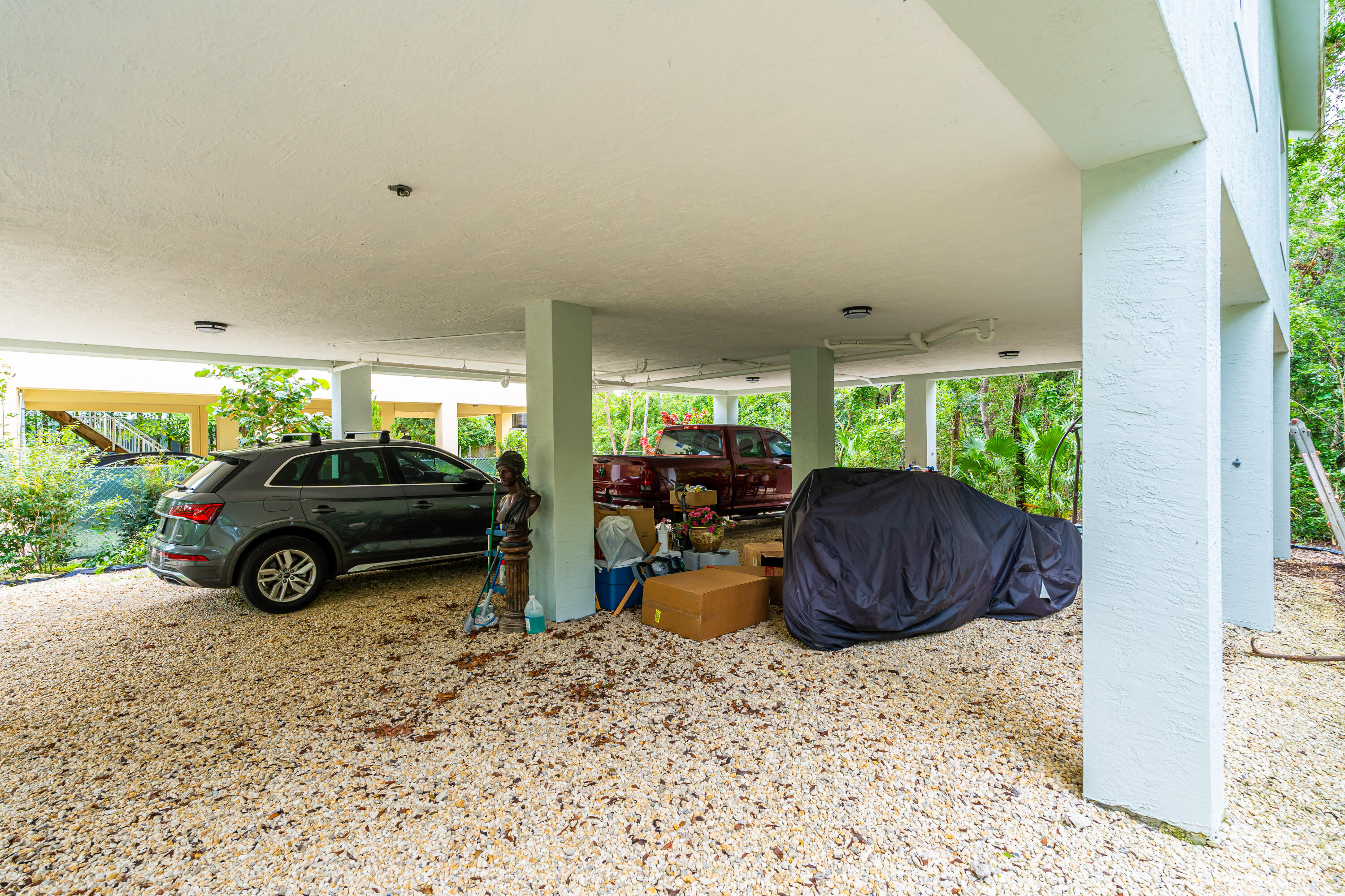 1023 Valencia Road Key Largo, FL 33037 - Photo 7 of 32 a view of a livingroom with furniture and a garage