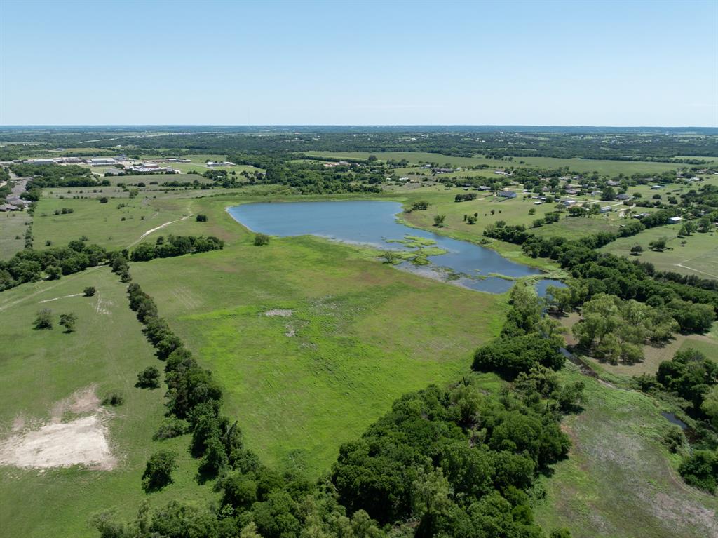 1355 North Houston Street Lorena, TX 76655 - Photo 32 of 40 an aerial view of a houses with a lake view