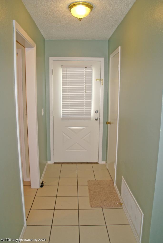 4816 South Austin Street Amarillo, TX 79110 - Photo 12 of 14 a view of an empty room with window and closet area