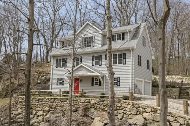 235 Wilton Road East Ridgefield, CT 06877 - Photo 1 of 1 a front view of a house with a yard