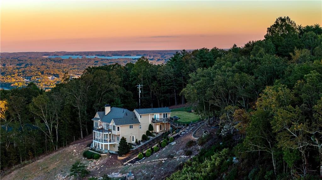 96 Barker Road Cumming, GA 30040 - Photo 1 of 1 an aerial view of a house with mountain view