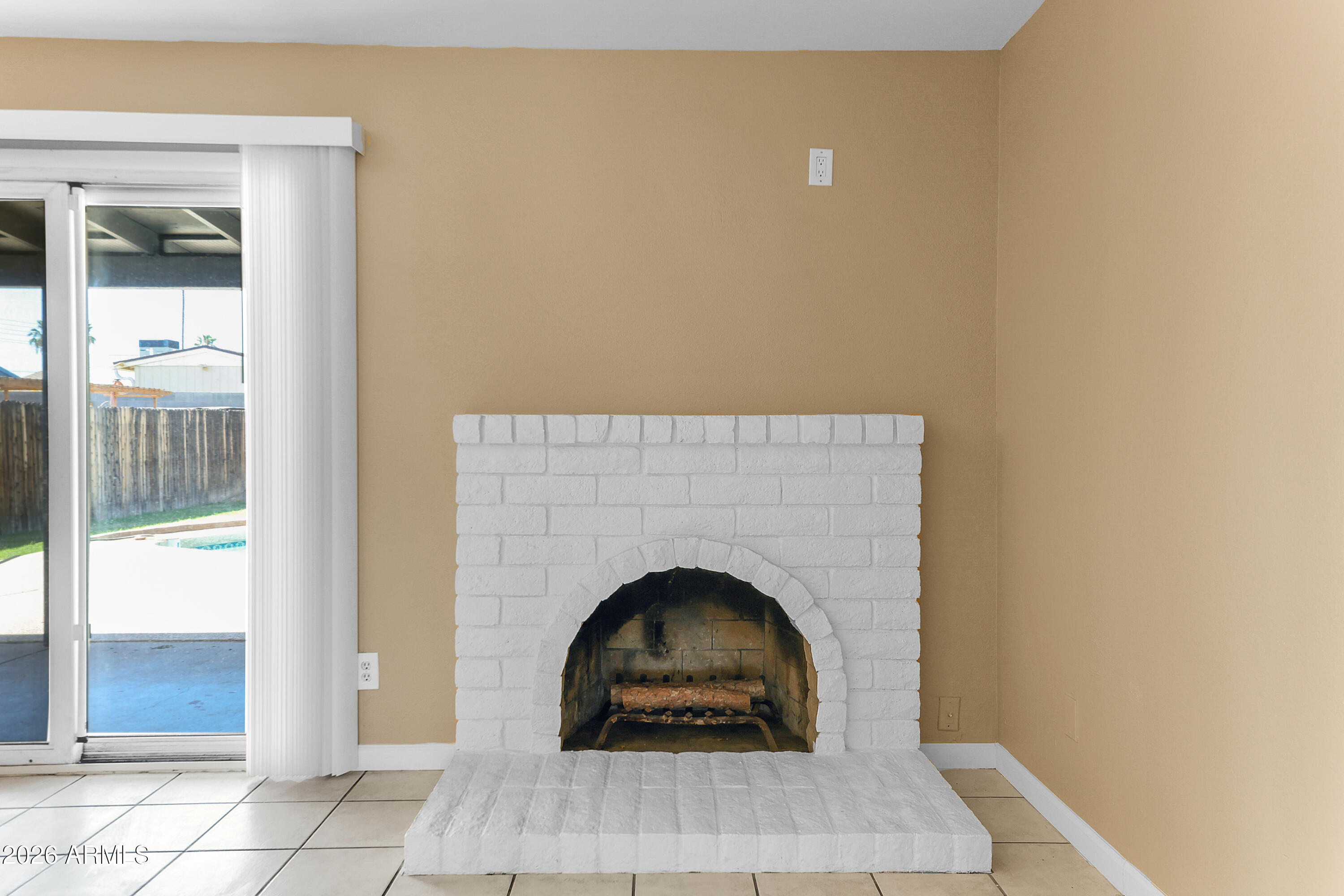 4723 East Vineyard Road Phoenix, AZ 85042 - Photo 10 of 27 a living room with a fireplace
