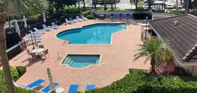 an aerial view of a house with outdoor space patio and swimming pool