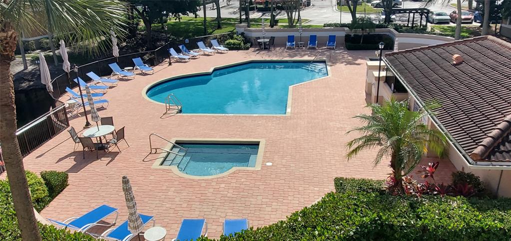 8781 Wiles Road, Unit 308 Coral Springs, FL 33067 - Photo 3 of 24 an aerial view of a house with outdoor space patio and swimming pool