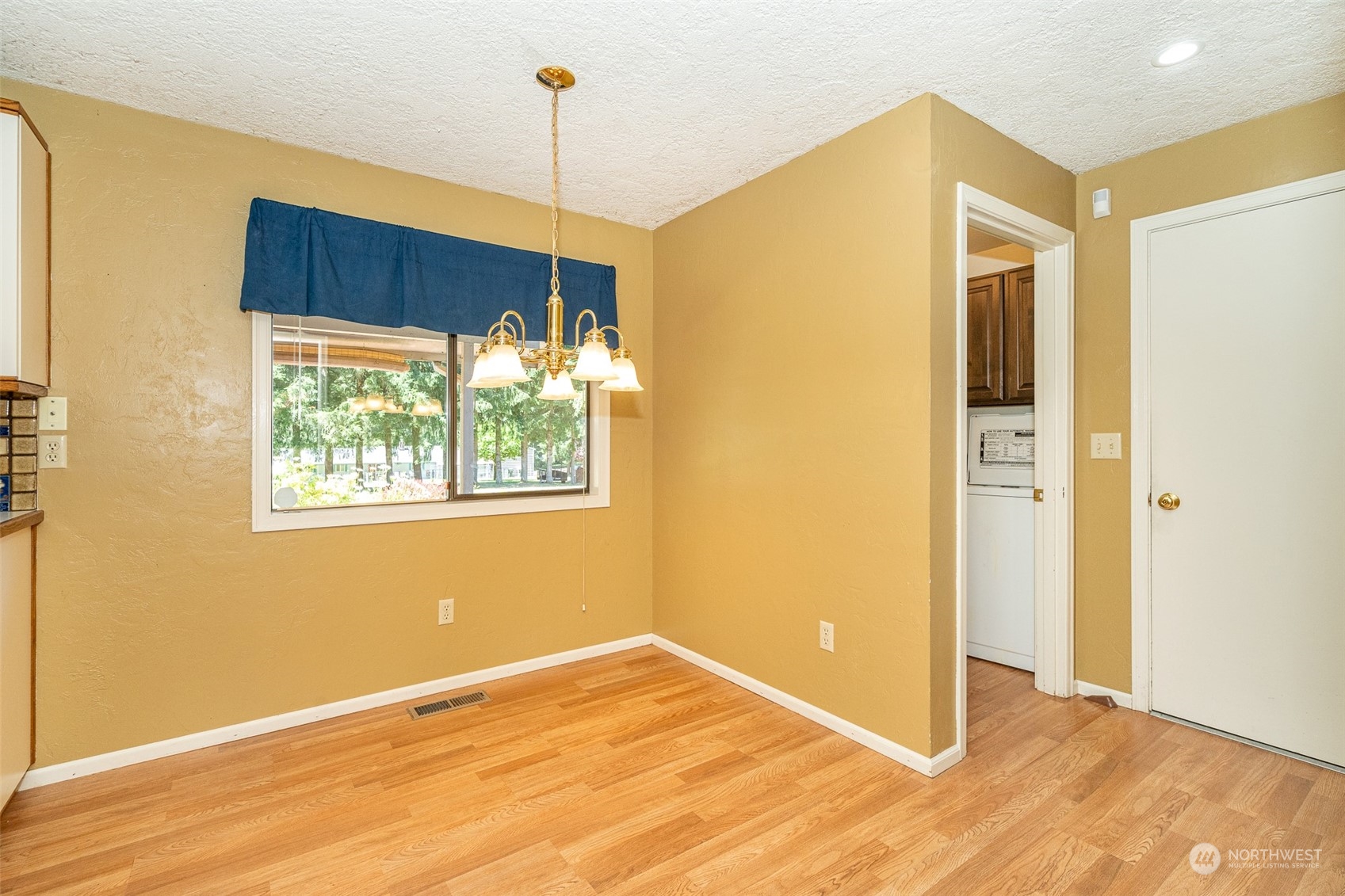 273 Brockway Road Chehalis, WA 98532 - Photo 21 of 39 a view of an empty room with wooden floor and a window