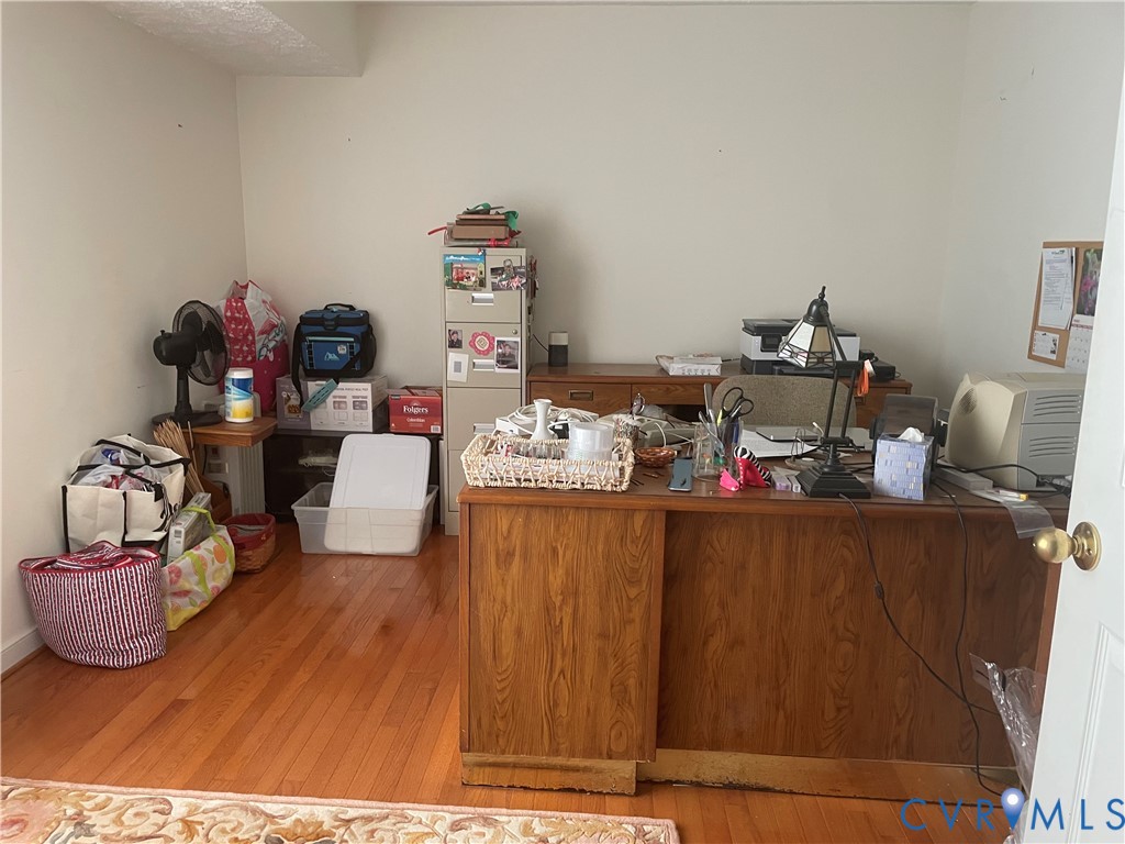 8002 Vaughan Road Petersburg, VA 23805 - Photo 23 of 31 a living room with furniture and a wooden floor