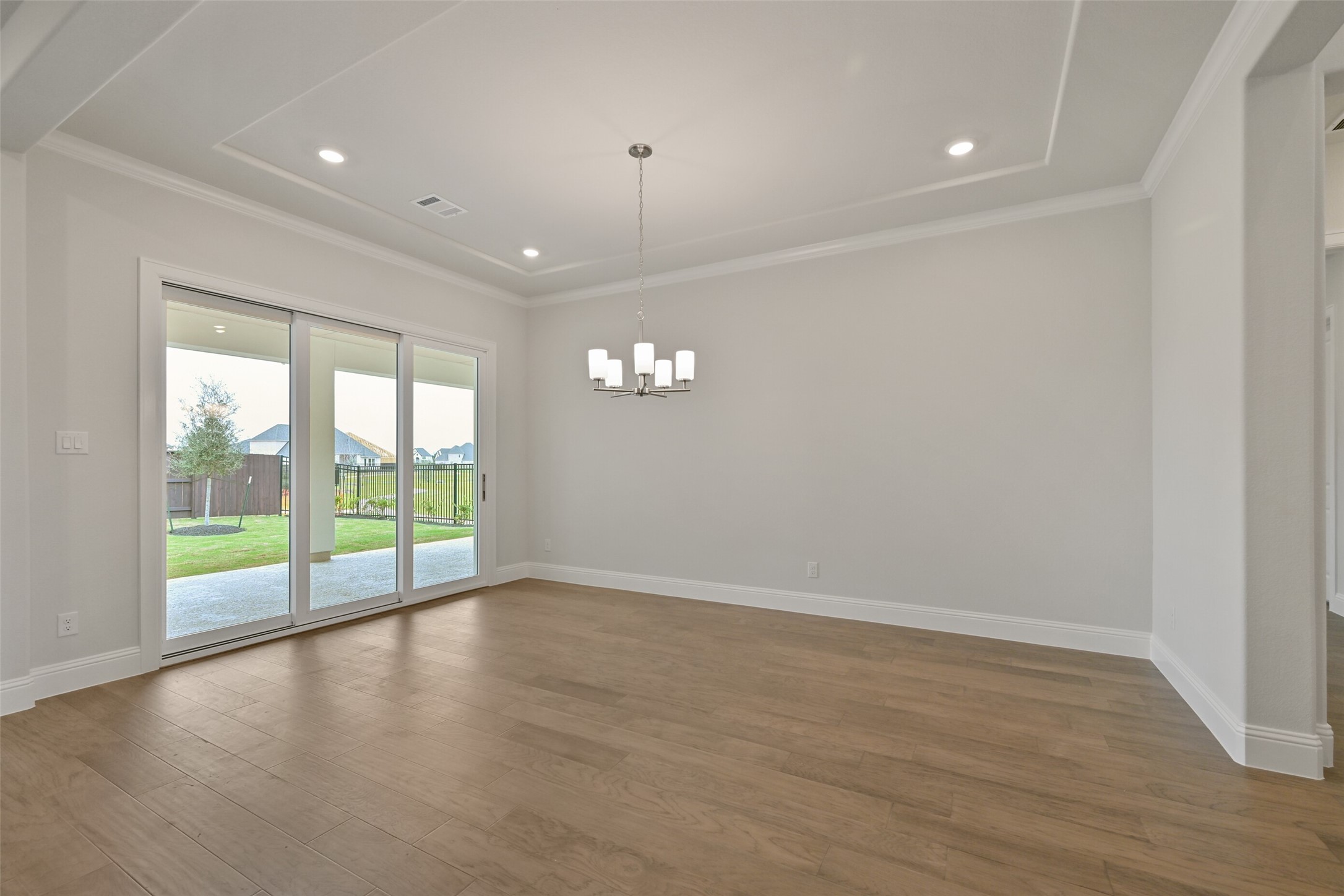 5215 Conifer Court Manvel, TX 77578 - Photo 13 of 49 wooden floor in an empty room with a window