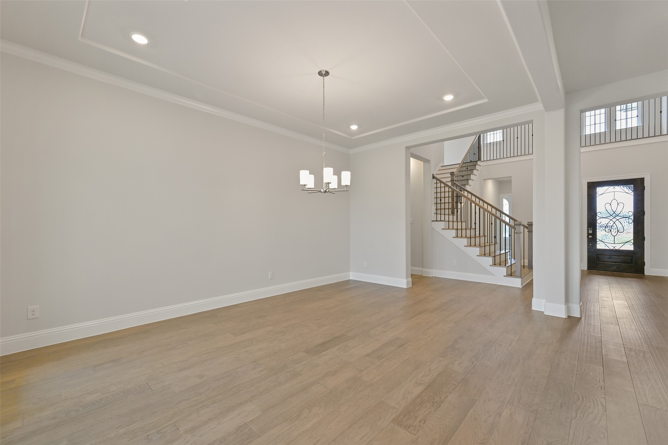 5215 Conifer Court Manvel, TX 77578 - Photo 15 of 49 an empty room with wooden floor and windows