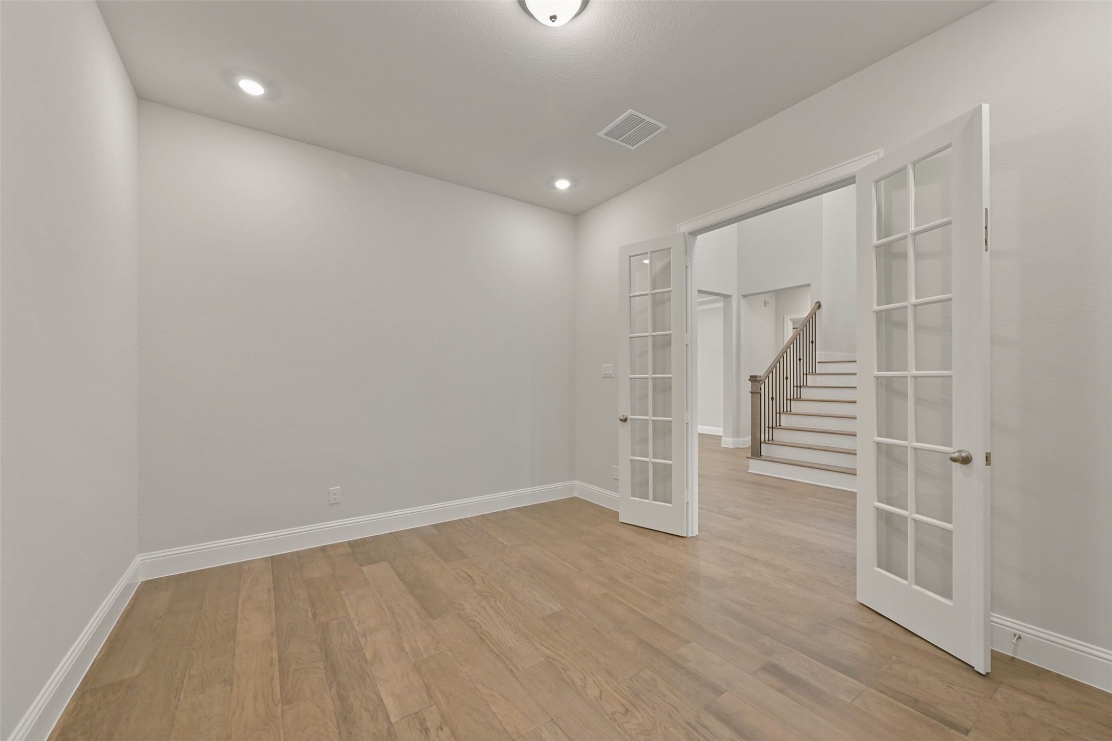 5215 Conifer Court Manvel, TX 77578 - Photo 17 of 49 wooden floor in an empty room with a window