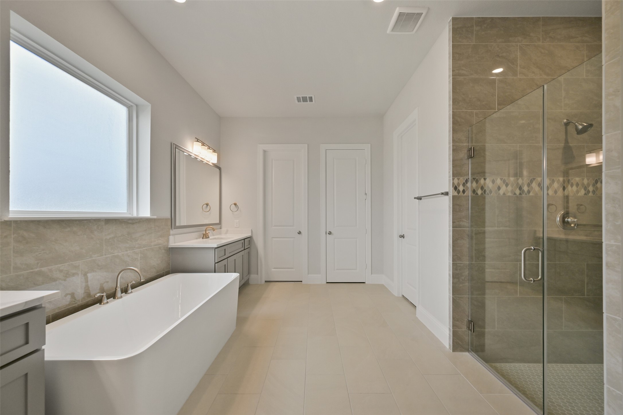 5215 Conifer Court Manvel, TX 77578 - Photo 21 of 49 a bathroom with a sink a toilet and shower