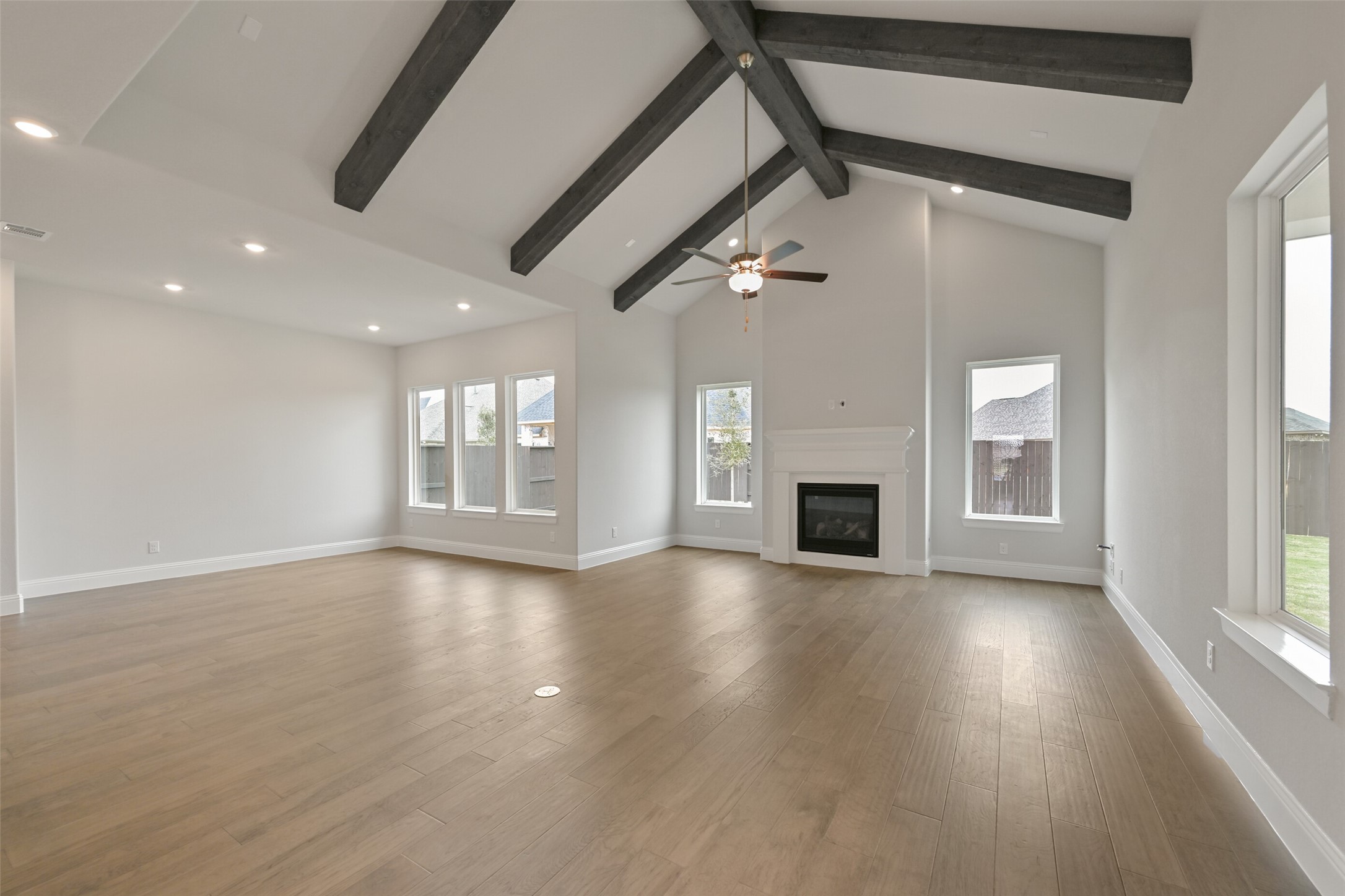5215 Conifer Court Manvel, TX 77578 - Photo 3 of 49 a view of an empty room with wooden floor and a window