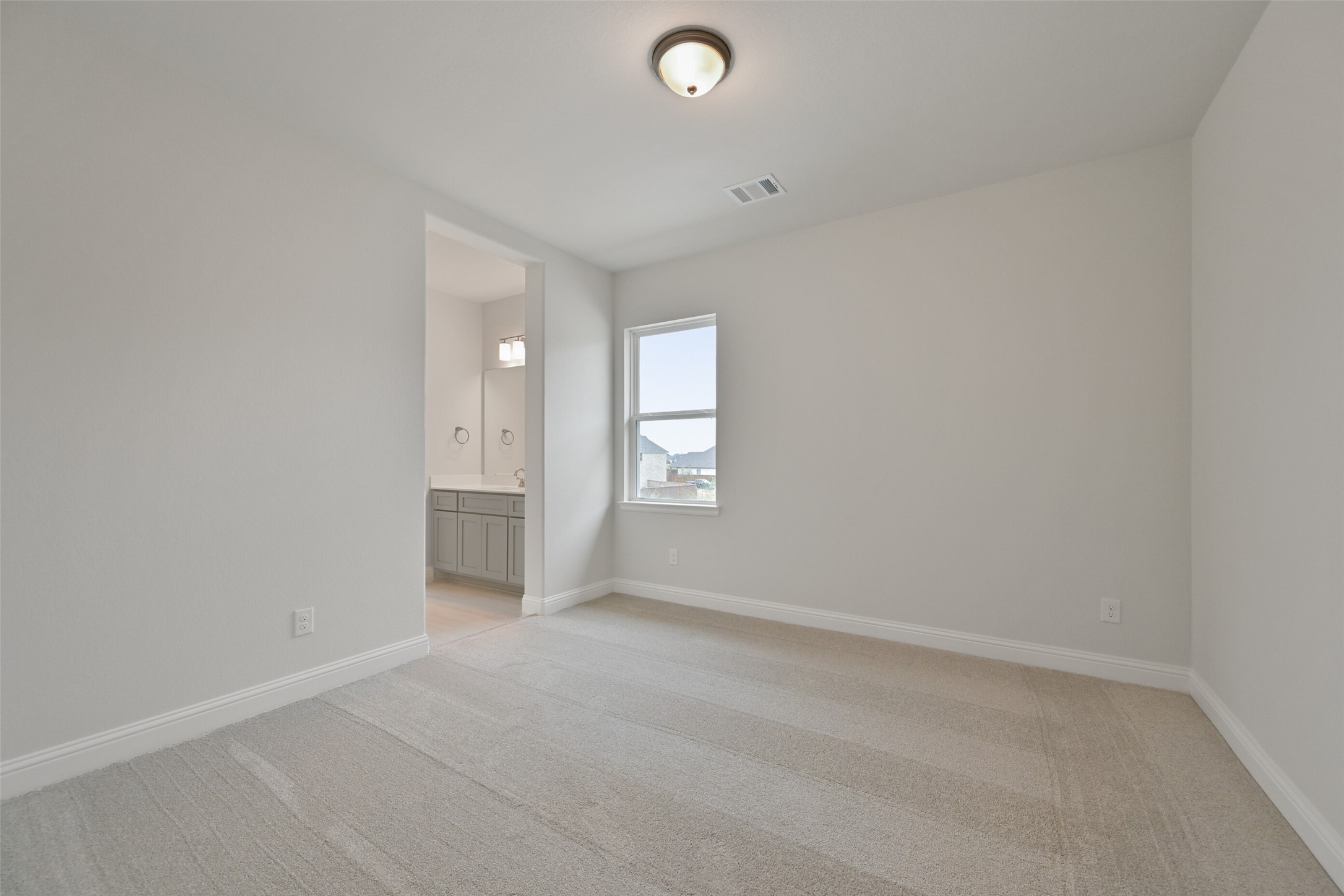 5215 Conifer Court Manvel, TX 77578 - Photo 35 of 49 a view of an empty room with a window and a bathroom