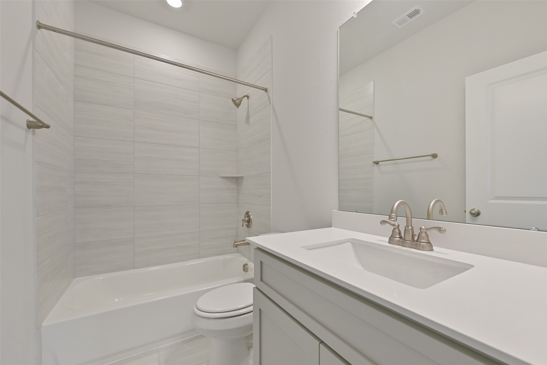 5215 Conifer Court Manvel, TX 77578 - Photo 39 of 49 a bathroom with a sink a toilet and a bathtub