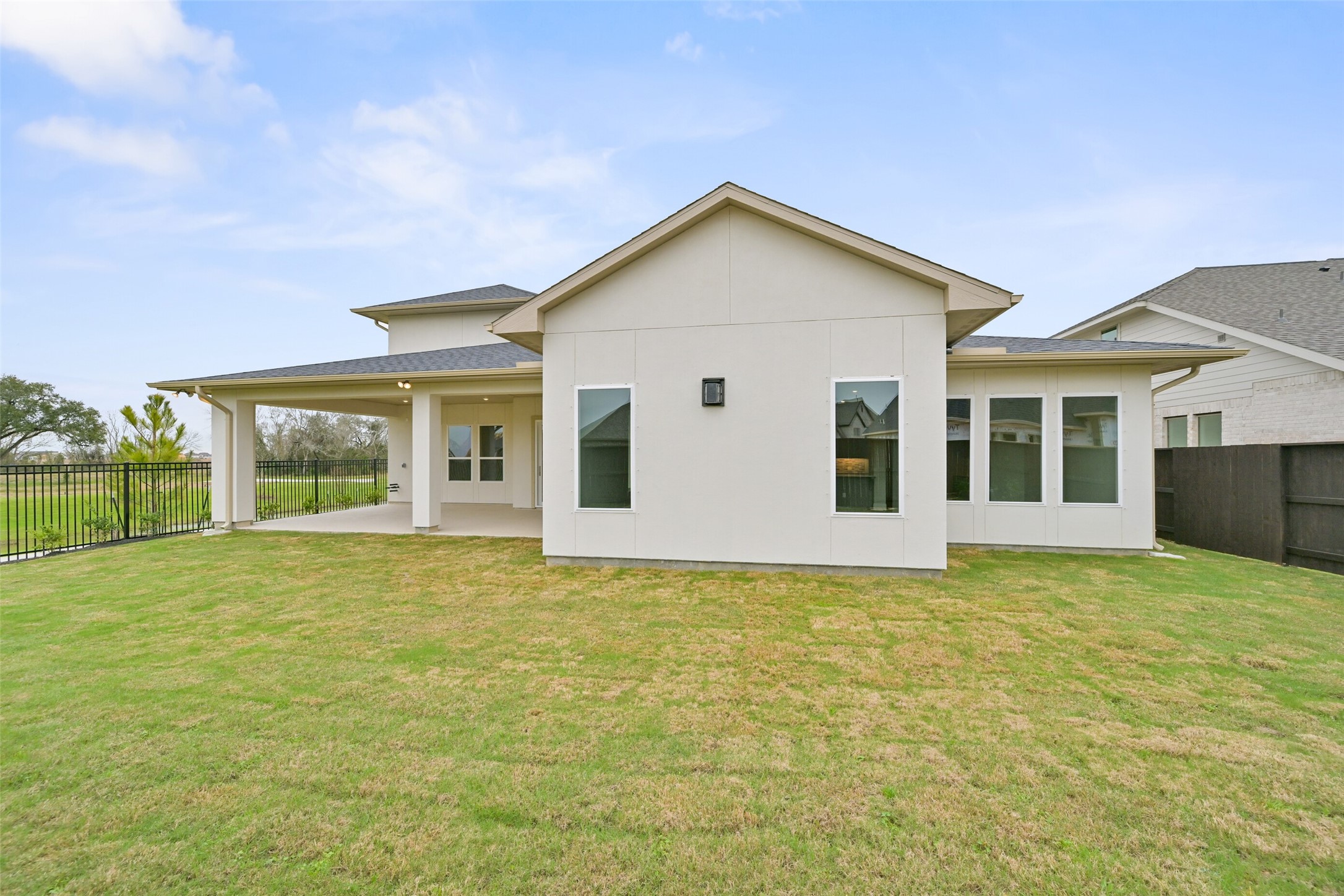 5215 Conifer Court Manvel, TX 77578 - Photo 46 of 49 a view of a house with a yard and potted plants