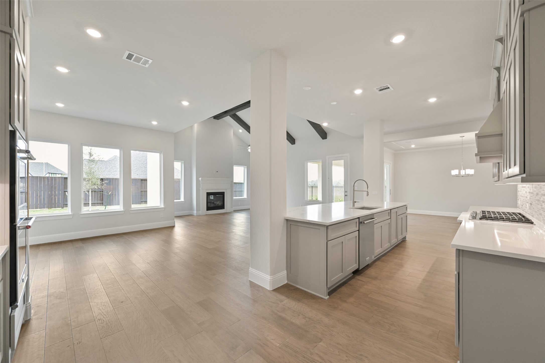 5215 Conifer Court Manvel, TX 77578 - Photo 9 of 49 a open kitchen with stove a sink and a view of living room