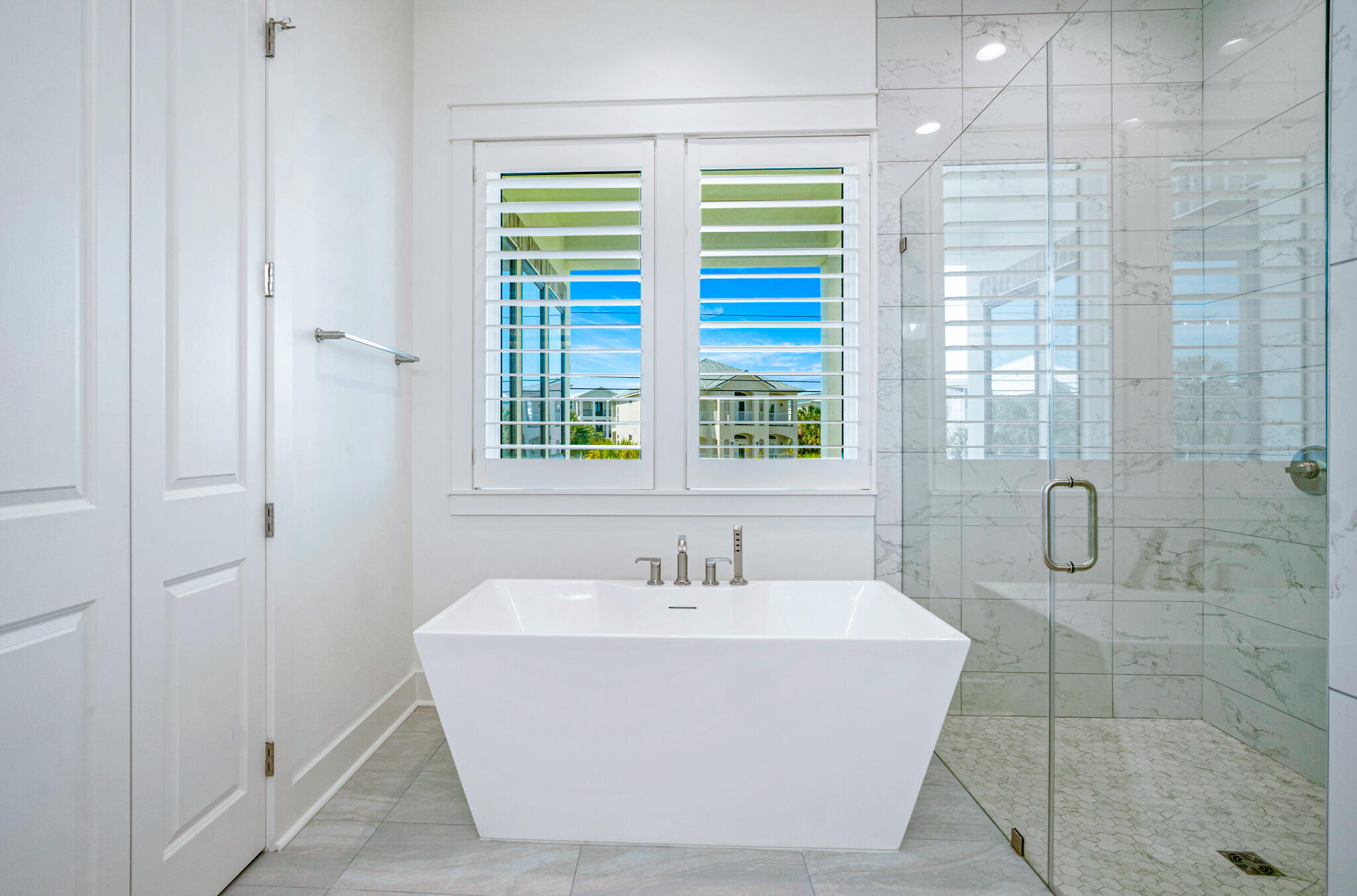 40 Cote D Azur Drive Santa Rosa Beach, FL 32459 - Photo 29 of 92 a white bath tub sitting next to a bathroom sink
