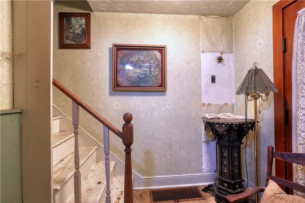 1210 Sharon Road Beaver, PA 15009 - Photo 18 of 18 a view of a hallway with wooden floor and staircase