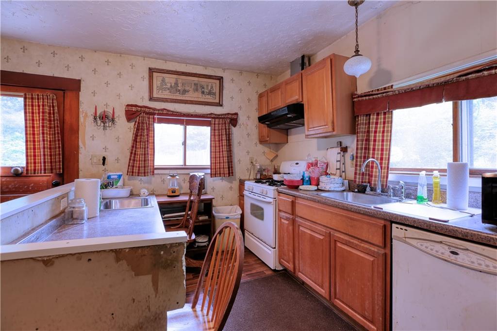 1210 Sharon Road Beaver, PA 15009 - Photo 8 of 18 a kitchen with lots of counter top space and wooden floor