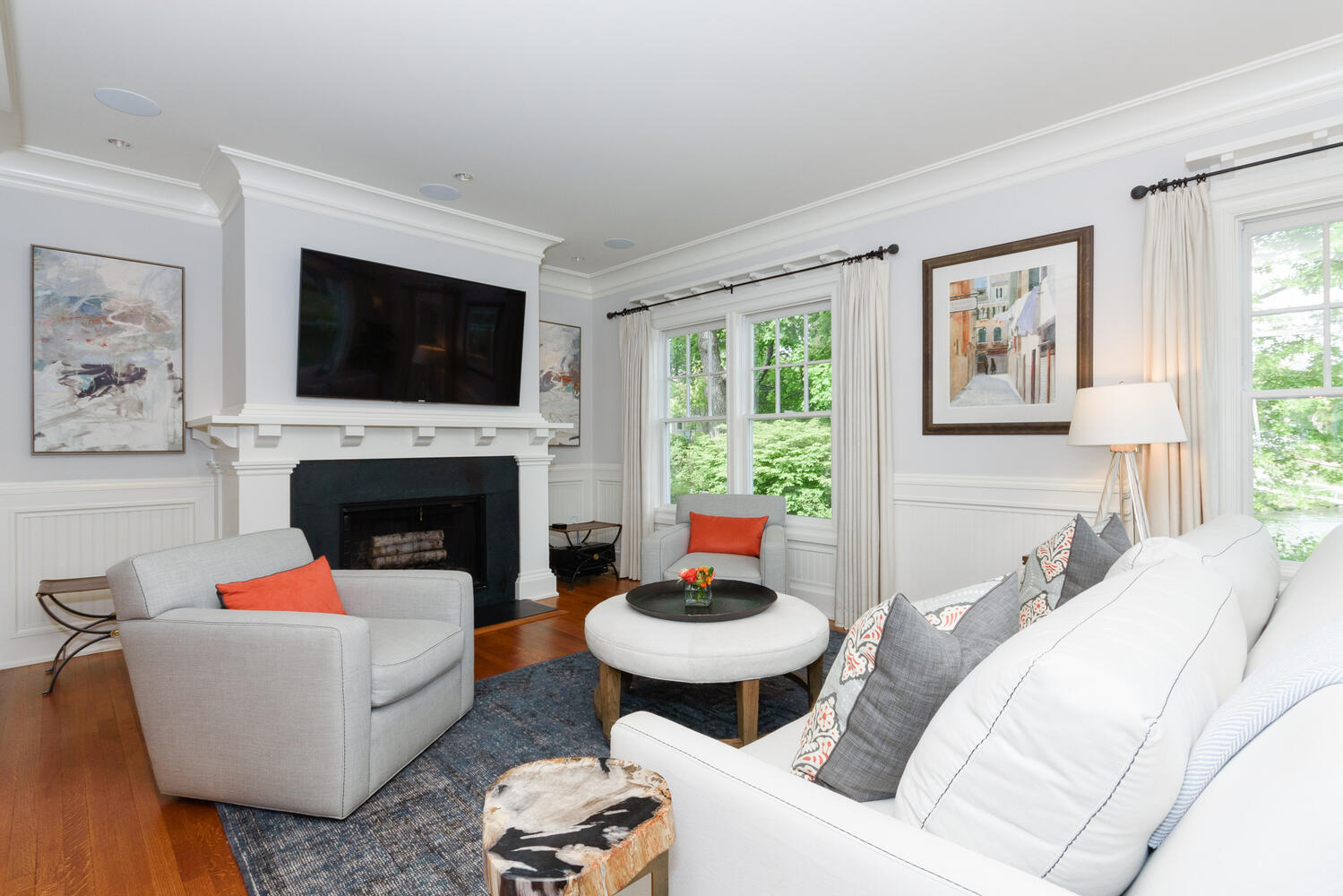 59 5 Mile River Road Darien, CT 06820 - Photo 11 of 39 a living room with furniture a flat screen tv and a fireplace