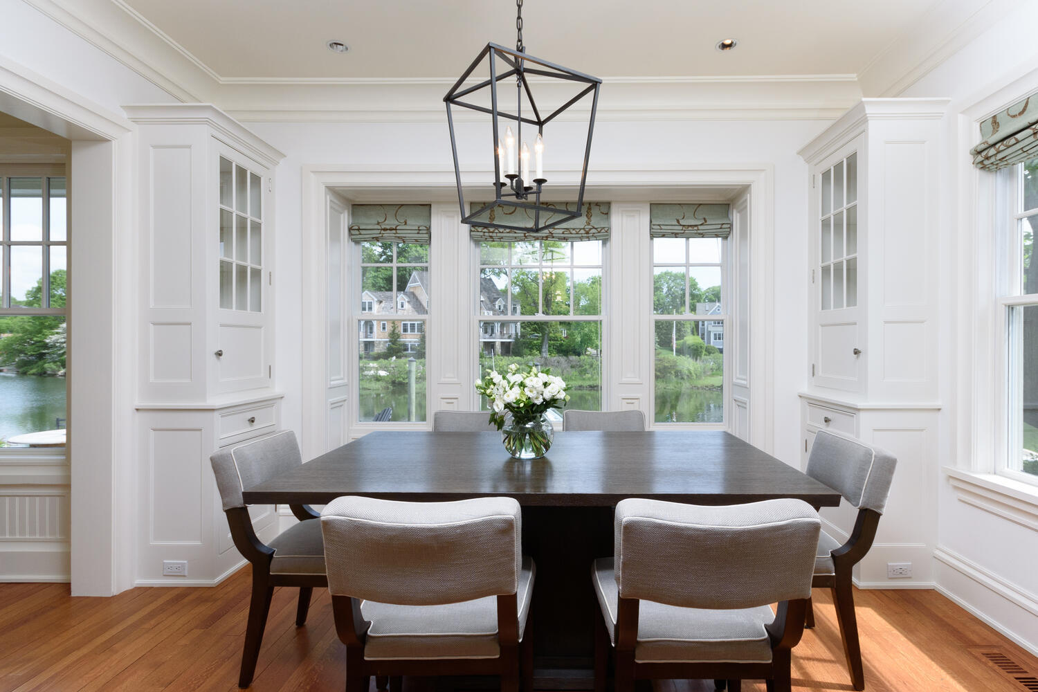59 5 Mile River Road Darien, CT 06820 - Photo 17 of 39 a view of a dining room with furniture window and wooden floor