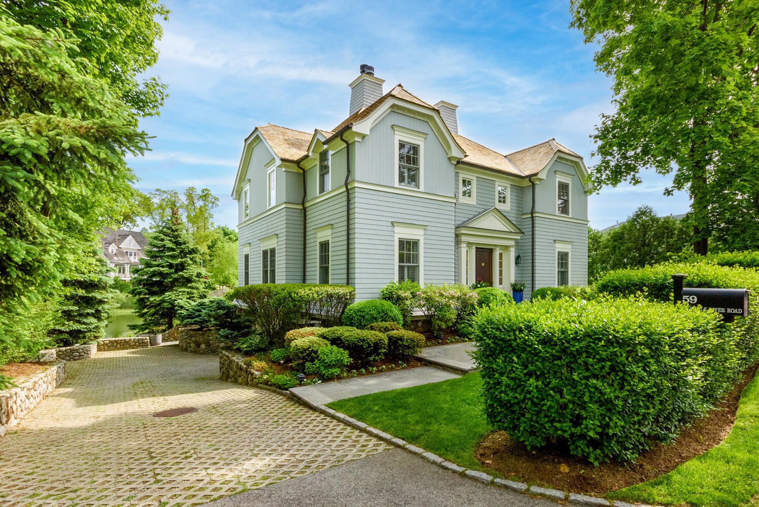 59 5 Mile River Road Darien, CT 06820 - Photo 2 of 39 a front view of a residential houses with yard