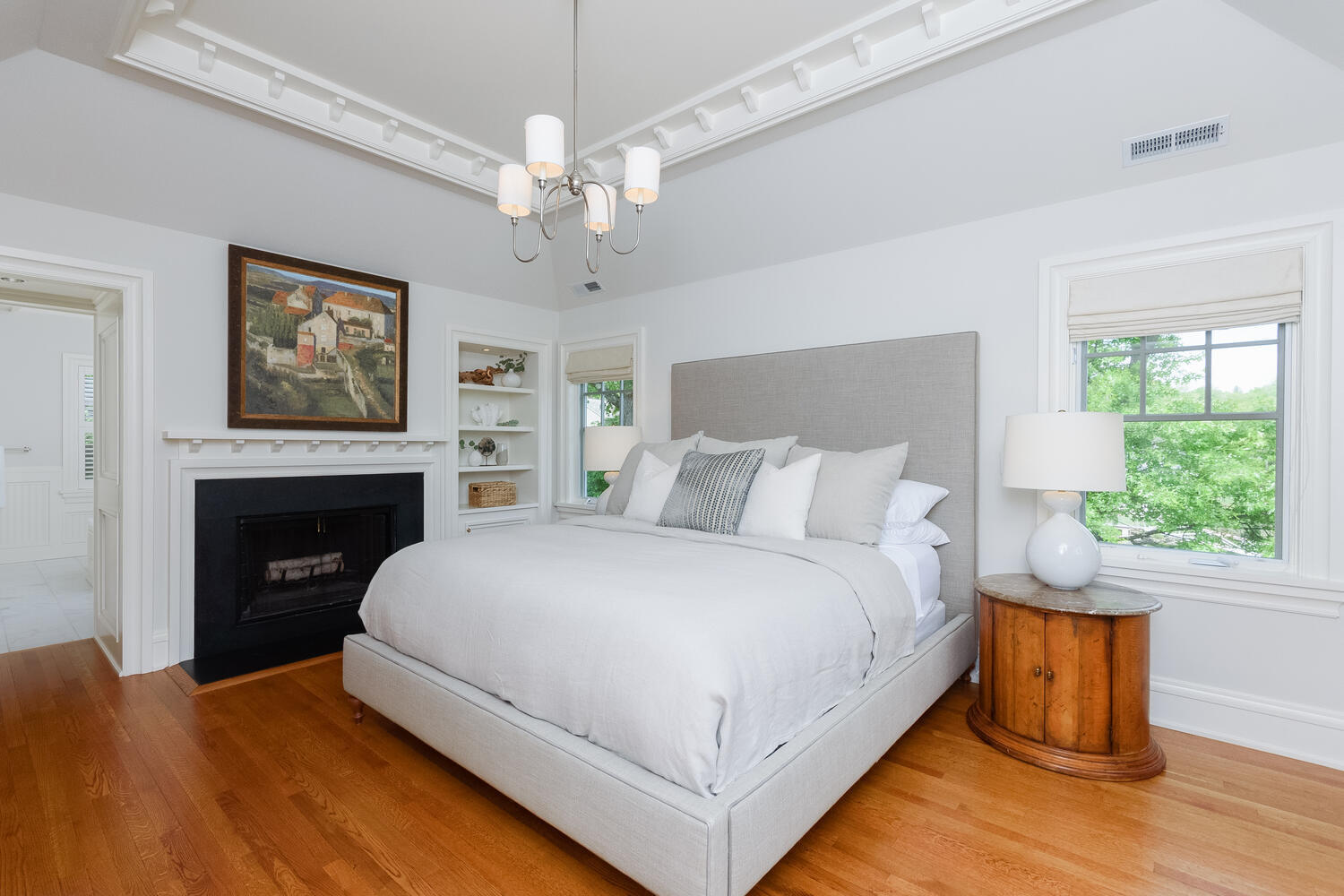 59 5 Mile River Road Darien, CT 06820 - Photo 21 of 39 a large bedroom with a bed and a fireplace