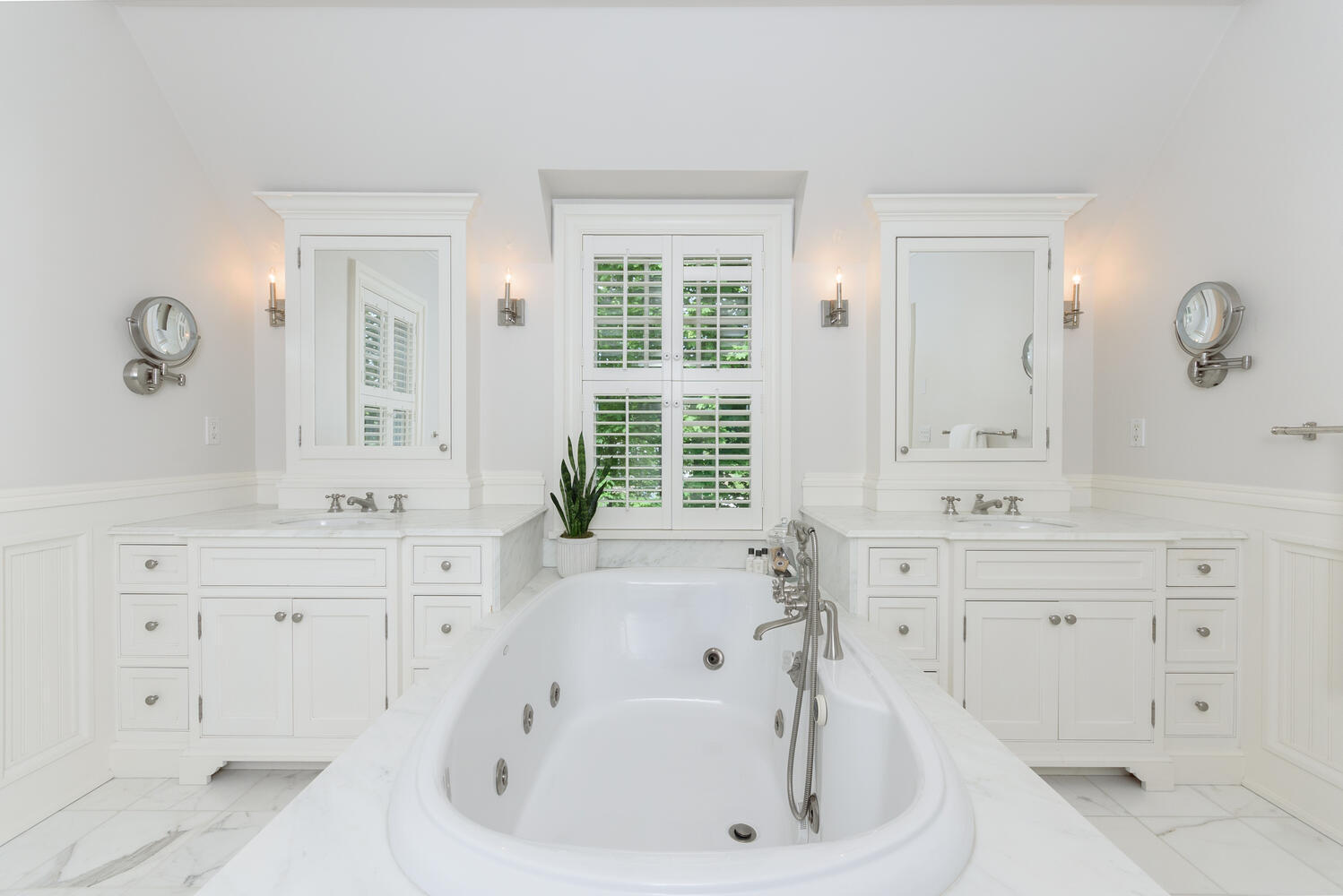 59 5 Mile River Road Darien, CT 06820 - Photo 23 of 39 a bathroom with a bathtub sink and mirror