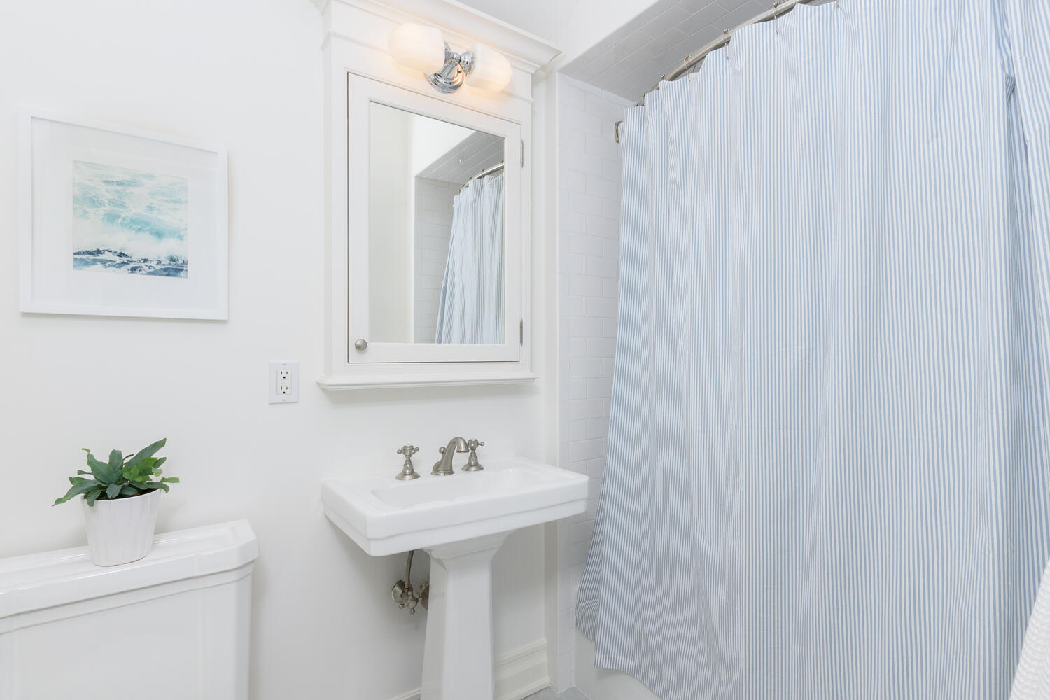 59 5 Mile River Road Darien, CT 06820 - Photo 25 of 39 a bathroom with a sink and a mirror