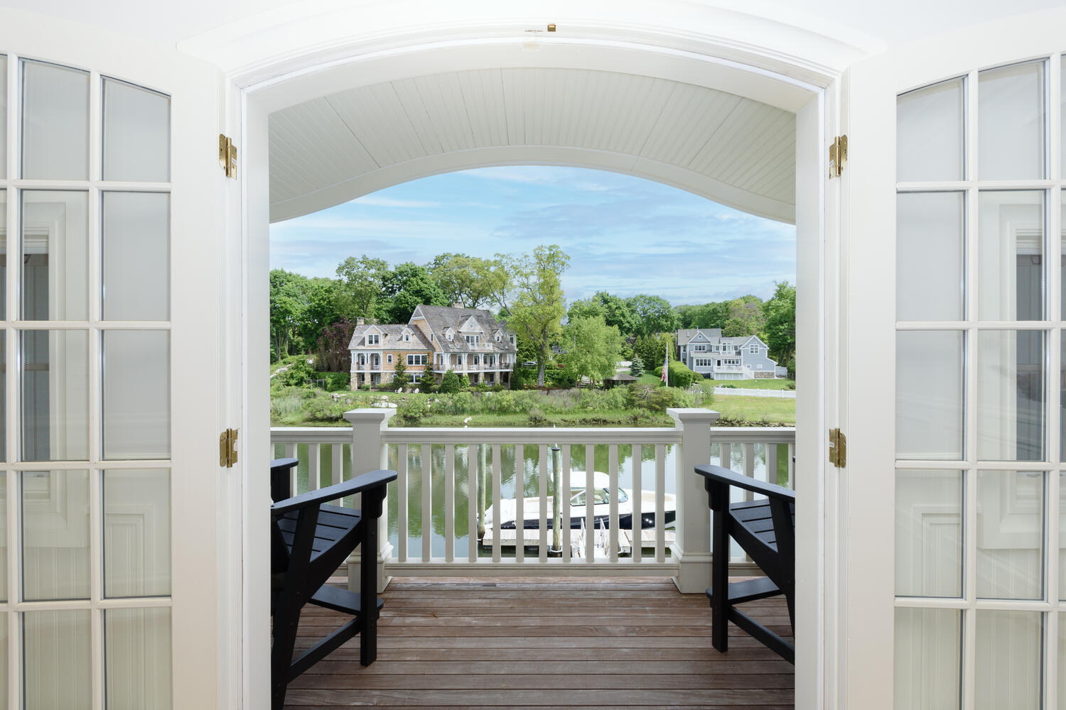 59 5 Mile River Road Darien, CT 06820 - Photo 28 of 39 a view of a balcony with lake view and a potted plant