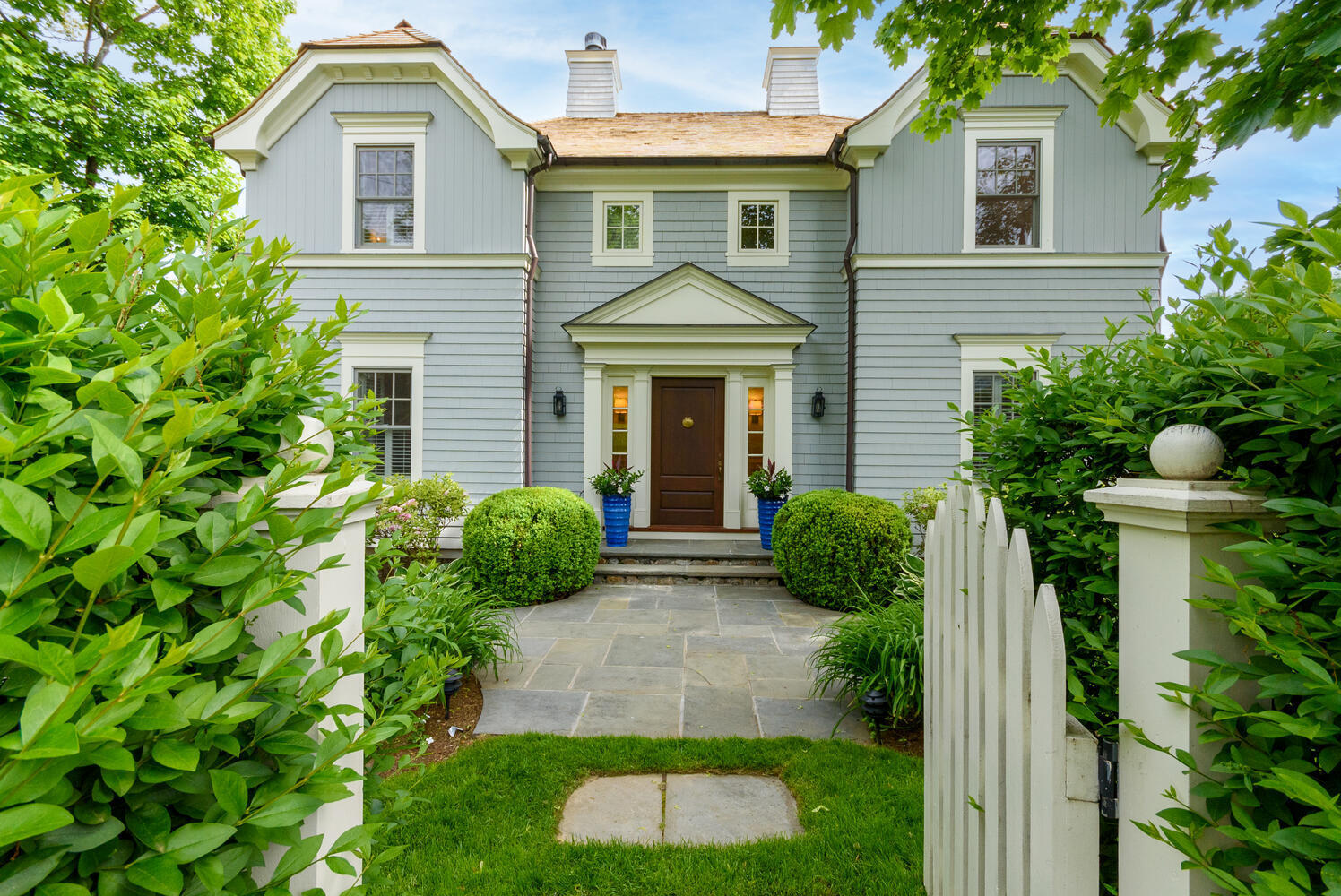 59 5 Mile River Road Darien, CT 06820 - Photo 3 of 39 a front view of a house with garden