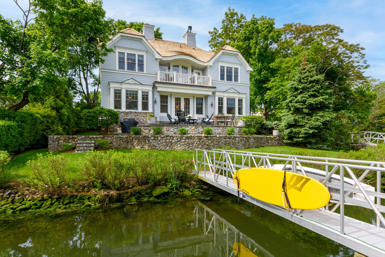 59 5 Mile River Road Darien, CT 06820 - Photo 31 of 39 a view of a house with swimming pool and sitting area