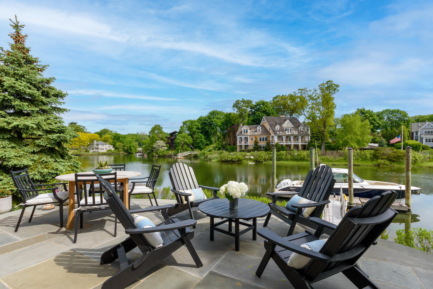 59 5 Mile River Road Darien, CT 06820 - Photo 34 of 39 a view of a lake with outdoor seating