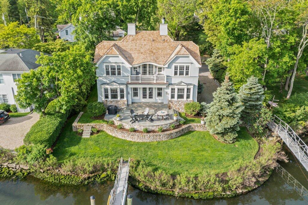 59 5 Mile River Road Darien, CT 06820 - Photo 36 of 39 a view of a house with swimming pool and a yard