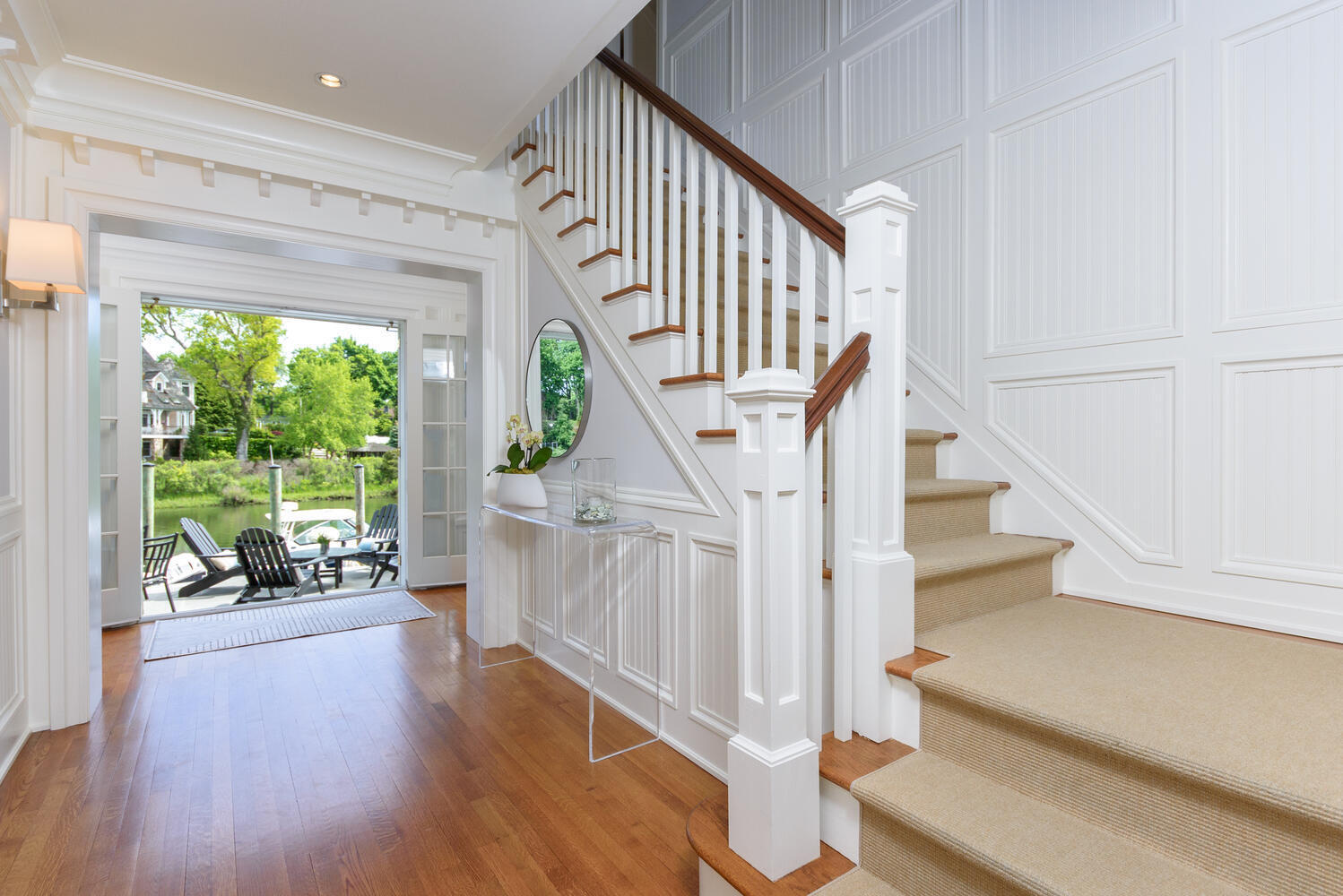 59 5 Mile River Road Darien, CT 06820 - Photo 6 of 39 a view of entryway and hall with wooden floor