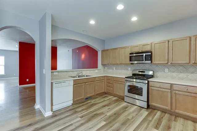 a view of a kitchen with a sink