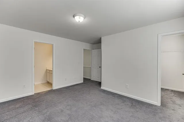 a bathroom with a sink vanity granite and toilet