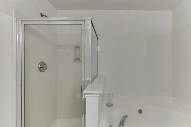 a bathroom with a sink double vanity and a mirror