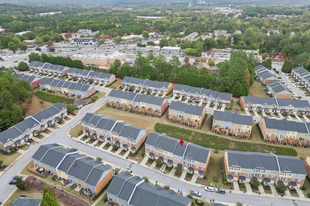 an aerial view of a house with outdoor space