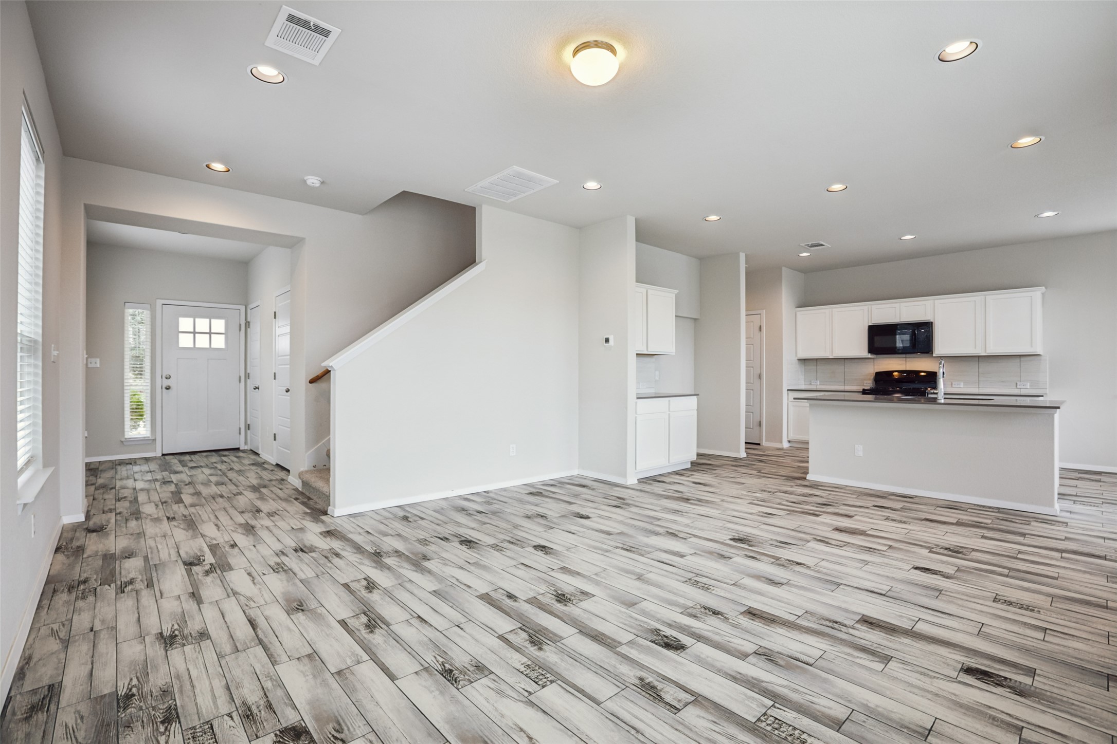 293 Gaida Loop Georgetown, TX 78628 - Photo 12 of 39 a view of kitchen view with wooden floor and window