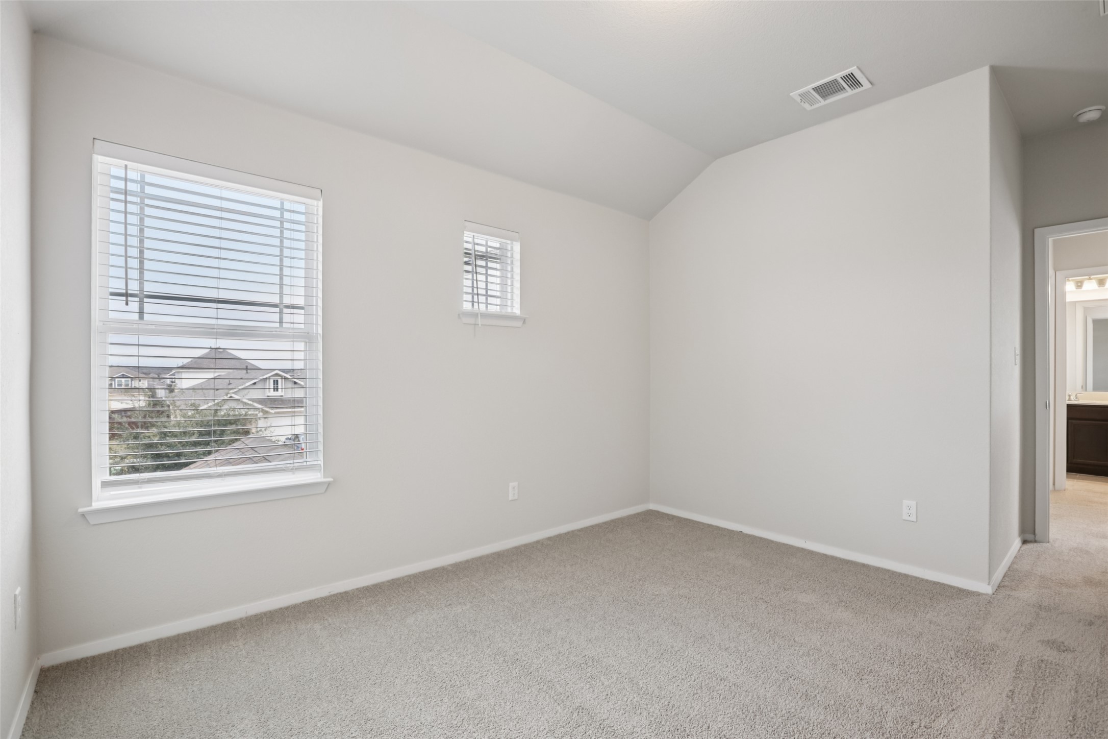 293 Gaida Loop Georgetown, TX 78628 - Photo 22 of 39 a view of an empty room with a window