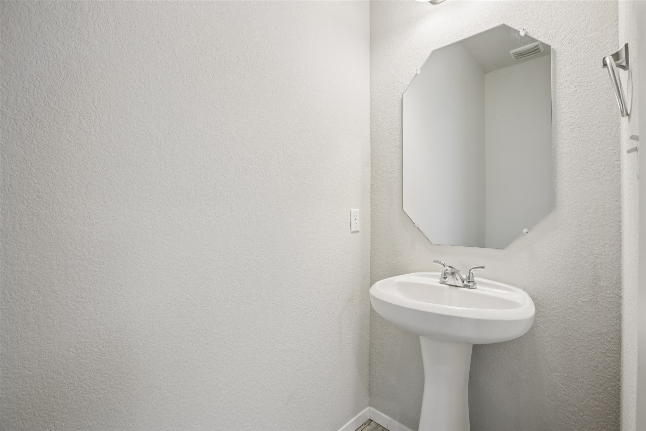 293 Gaida Loop Georgetown, TX 78628 - Photo 27 of 39 a bathroom with a sink and mirror
