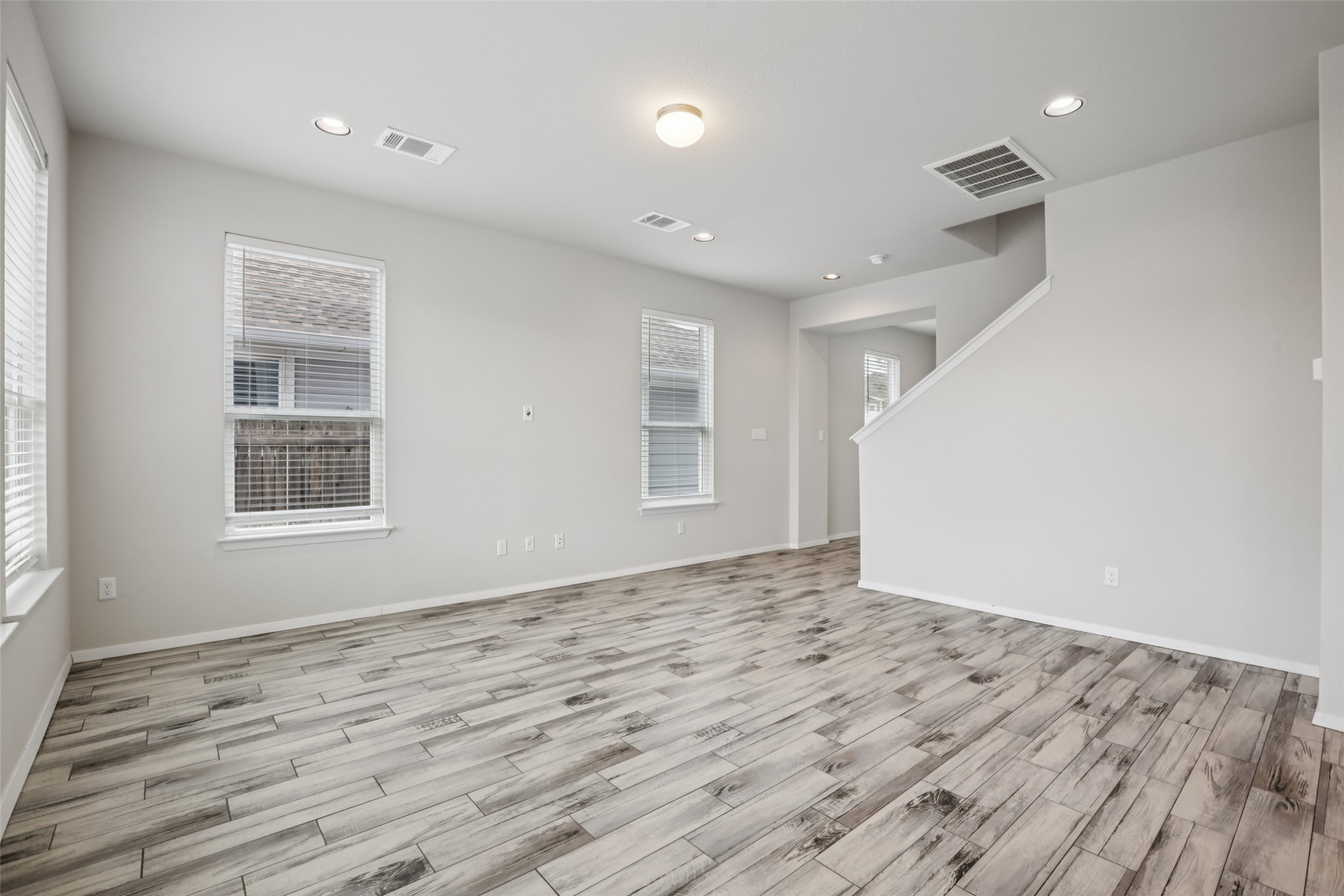 293 Gaida Loop Georgetown, TX 78628 - Photo 3 of 39 a view of empty room with wooden floor and fan