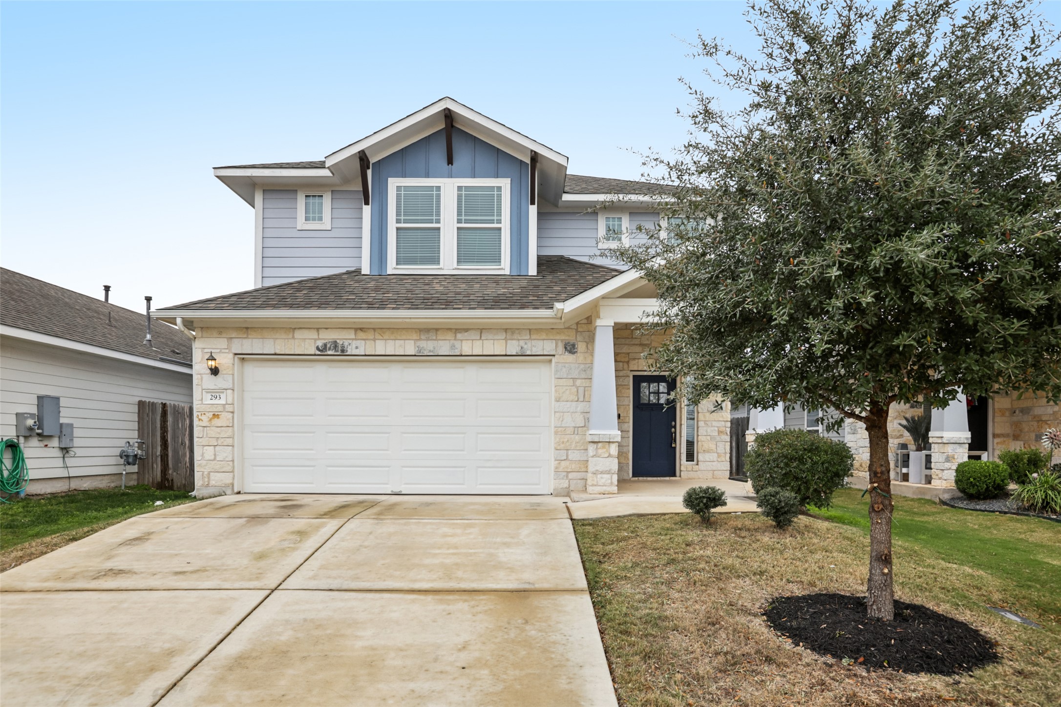 293 Gaida Loop Georgetown, TX 78628 - Photo 35 of 39 a front view of a house with a yard and garage