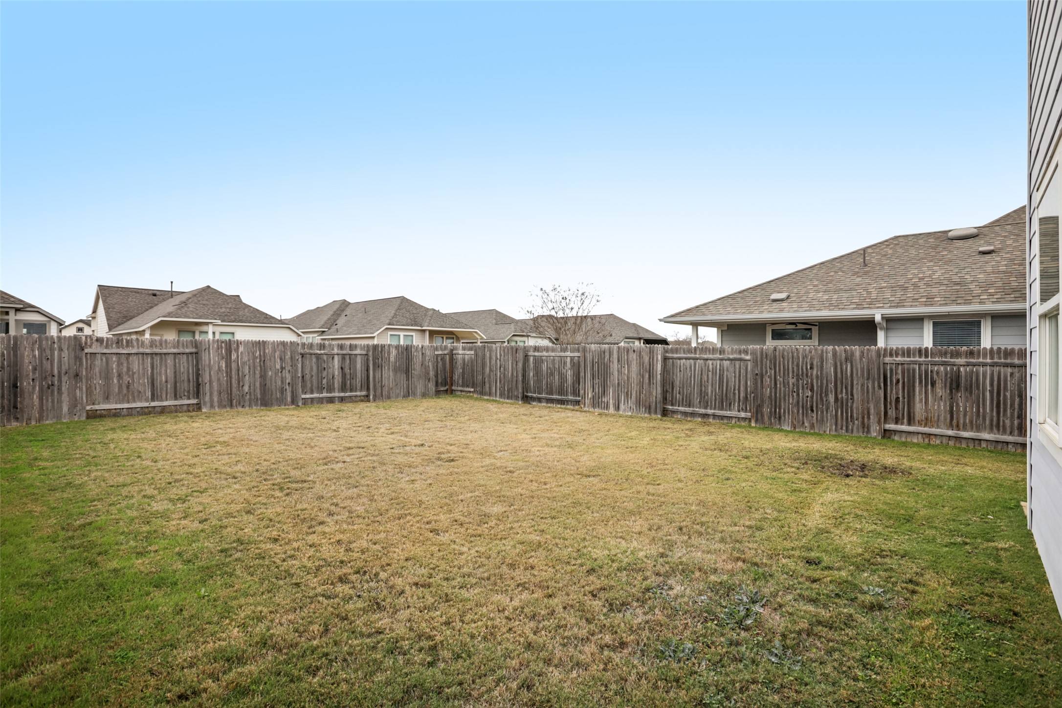 293 Gaida Loop Georgetown, TX 78628 - Photo 36 of 39 a view of an house with backyard and wooden fence